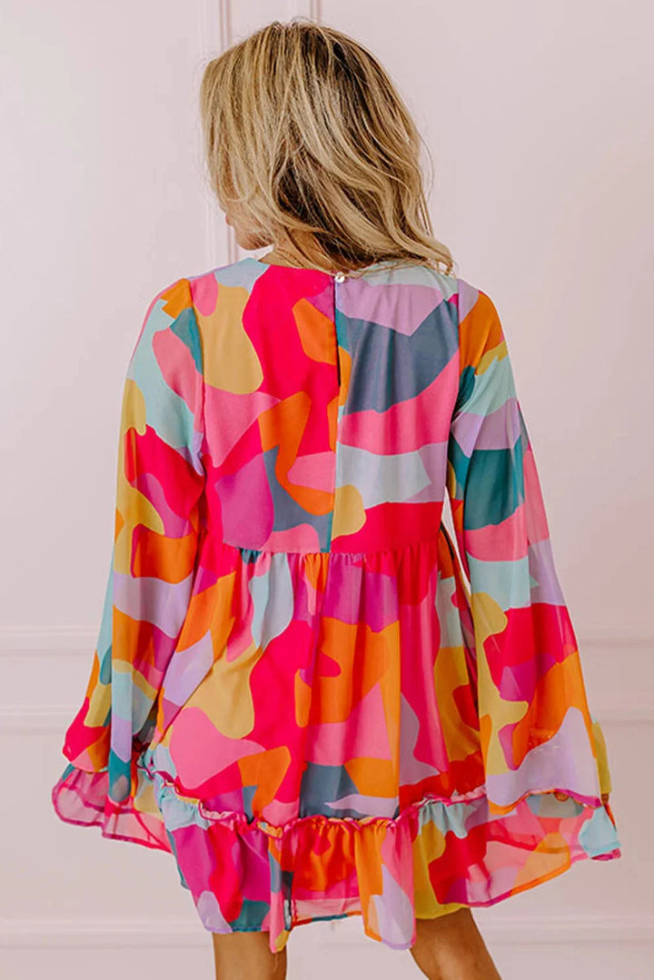 Averee babydoll dress with vibrant print and V-neck, perfect for a casual chic look.