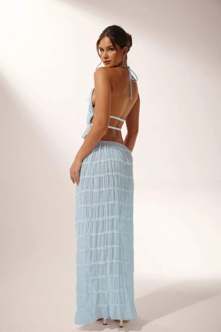Light blue pleated halter crop top and skirt set with a flowy design, perfect for a casual yet stylish look.