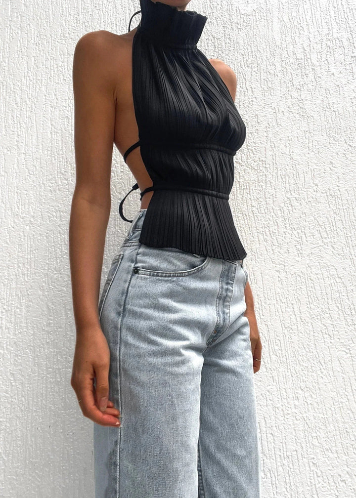 Women's halter top with metallic chain details, made from lightweight and breathable fabric. Unique design for a fashionable…