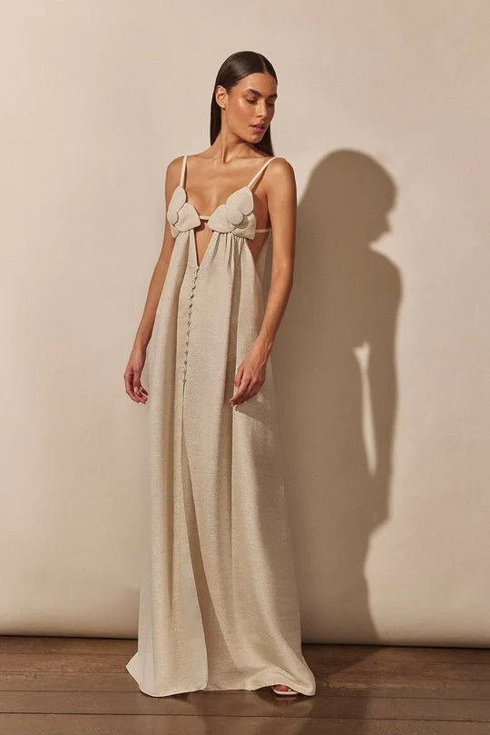 "Beige maxi dress featuring floral details, slit, and comfortable lightweight fabric."