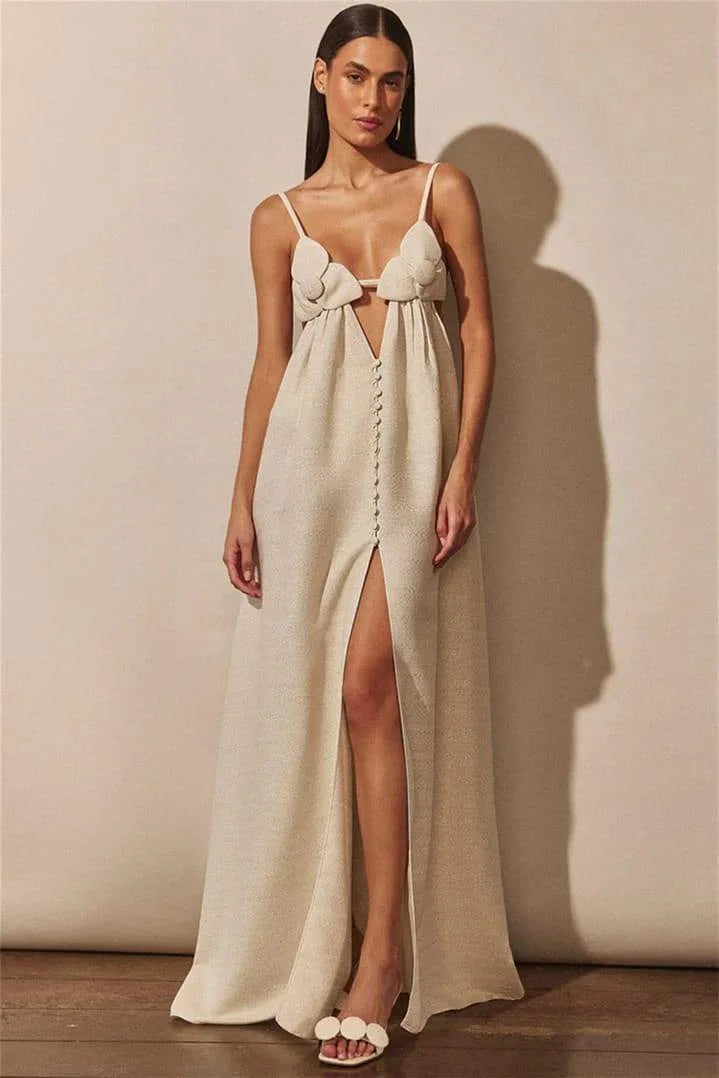 Beige maxi dress in Apricot with floral details, slit, and airy fabric, perfect for spring events.