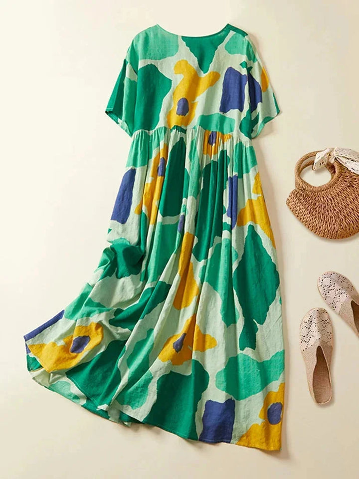 "Maxi dress featuring short sleeves with bold print design, perfect for casual or dressy occasions - made from comfortable…