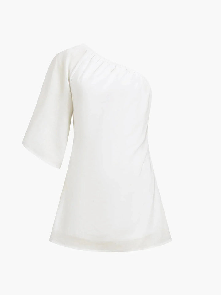 "Off-shoulder mini dress in Azalia, featuring puff sleeves and a flattering silhouette, perfect for a chic and stylish look."