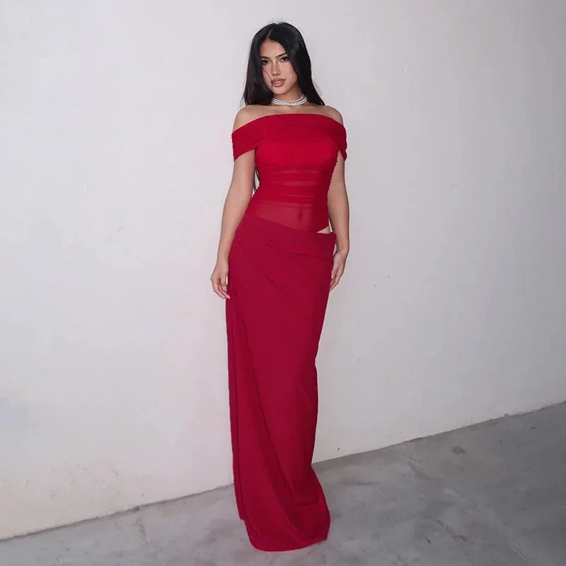 Off-shoulder ruched maxi dress with waist cut-out in soft crepe fabric, perfect for a summer evening out.