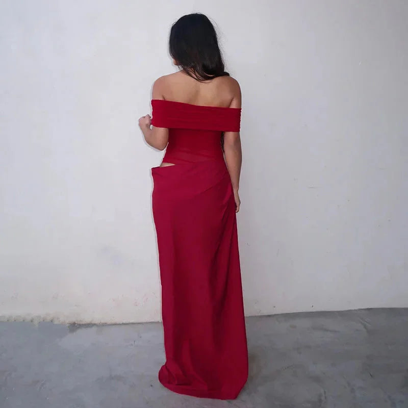 Off-shoulder ruched maxi dress in white. Features waist cut-out detail and flowy silhouette, perfect for summer events.