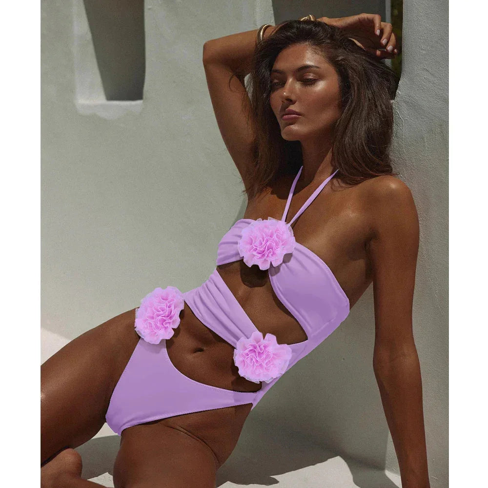 "Floral applique two-piece swimsuit with intricate detailing, ideal for a stylish beach look this summer."