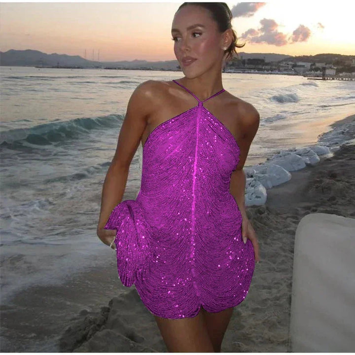 Purple halter neckline dress with asymmetrical hem. Made of soft textured fabric in a stylish modern design.