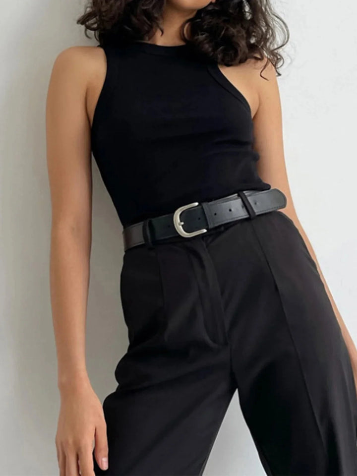 "Black ribbed tank top with a sleeveless design, perfect for versatile styling"