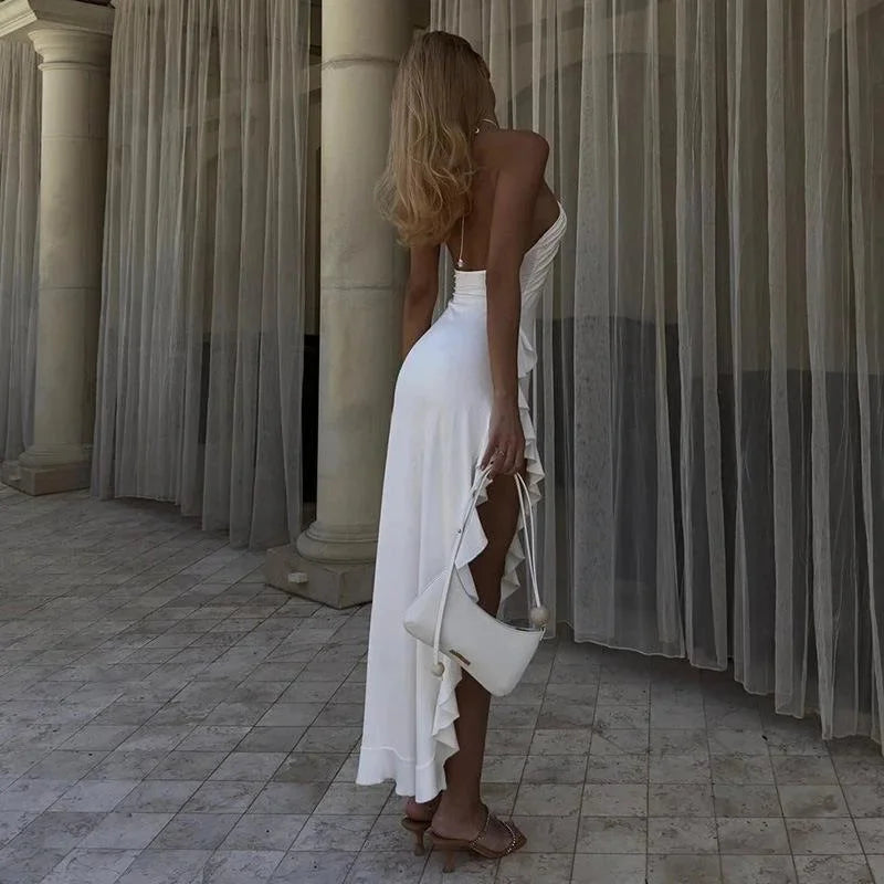 White asymmetrical halter midi dress with a modern design, perfect for formal events. Made from high-quality fabric.