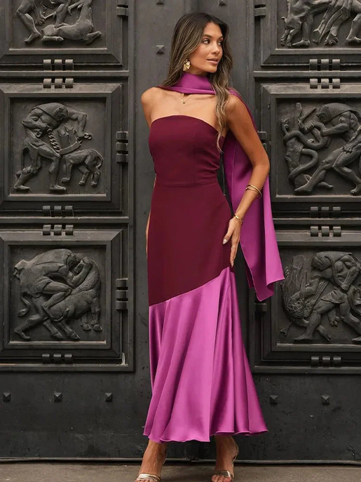 "Burgundy and pink midi dress with asymmetric design, perfect for special occasions. Made with high-quality fabrics."