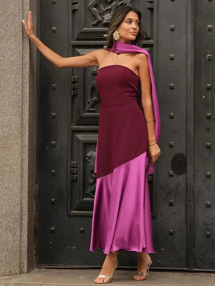 Burgundy and pink dress with asymmetric design, midi length, perfect for a chic look.