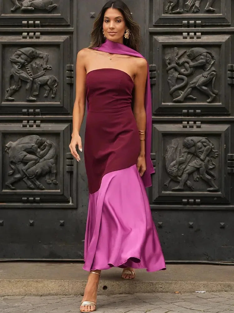Burgundy and pink asymmetric midi dress with eye-catching design and flattering silhouette, made from high-quality fabric.