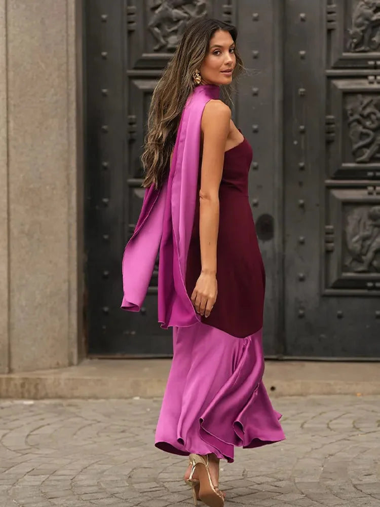 "Burgundy and pink asymmetric midi dress, featuring a draped silhouette and intricate detailing, perfect for a stylish and…