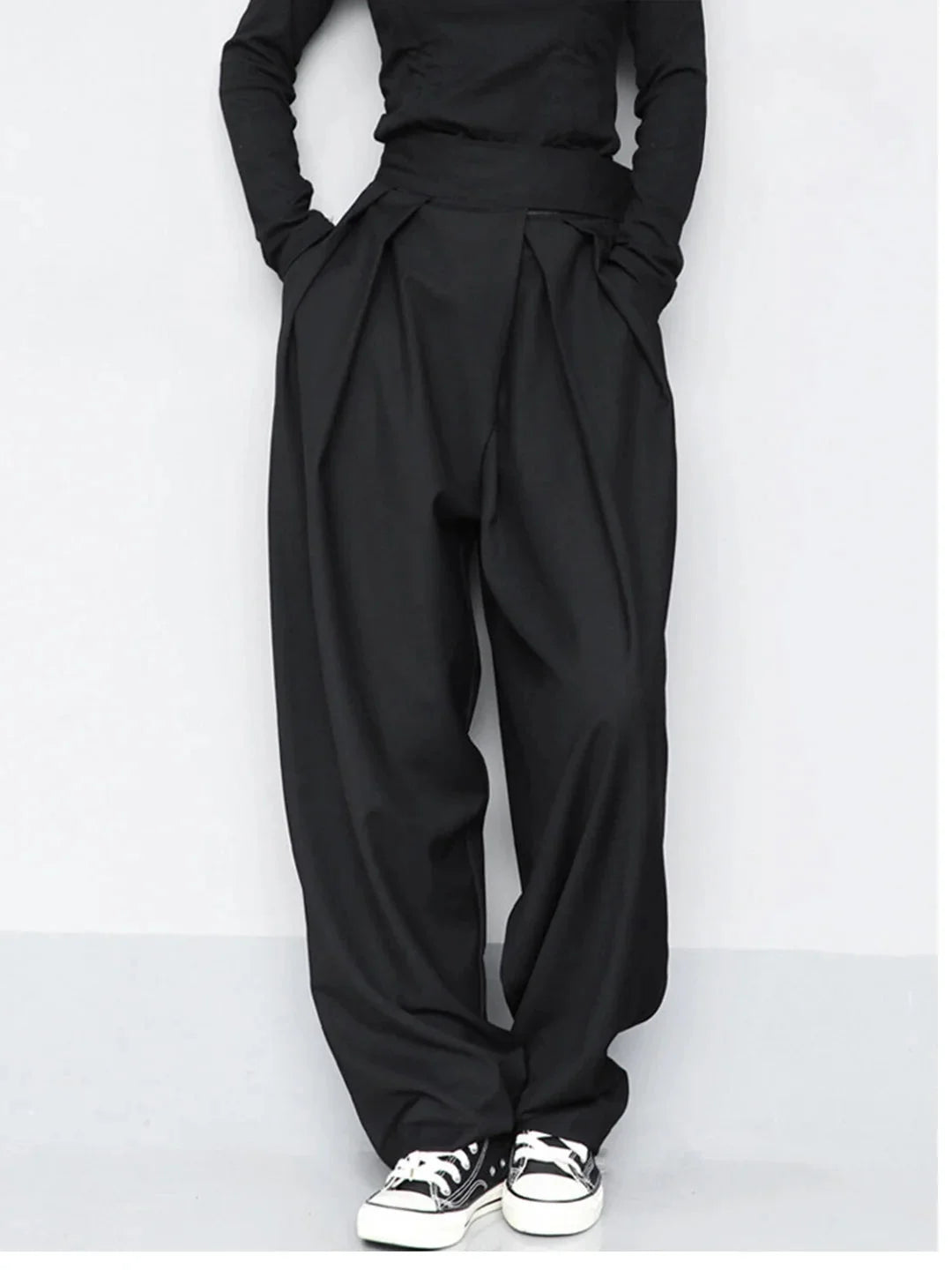 Black wide-leg pants with adjustable fit. Made from comfortable and durable fabric. Perfect for everyday wear with a classic…