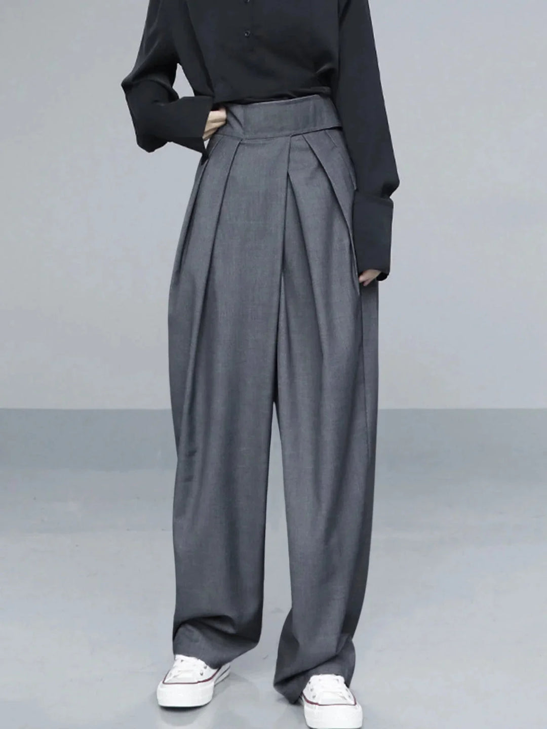 Gray wide-leg pants with adjustable fit. Made with durable, comfortable fabric. Perfect for a casual yet stylish look.