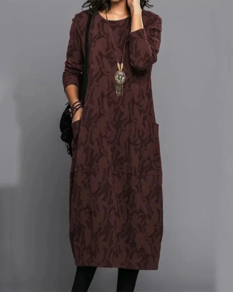Burgundy midi dress with camo pattern, designed for comfort. Made with soft, breathable fabric perfect for casual outings or…