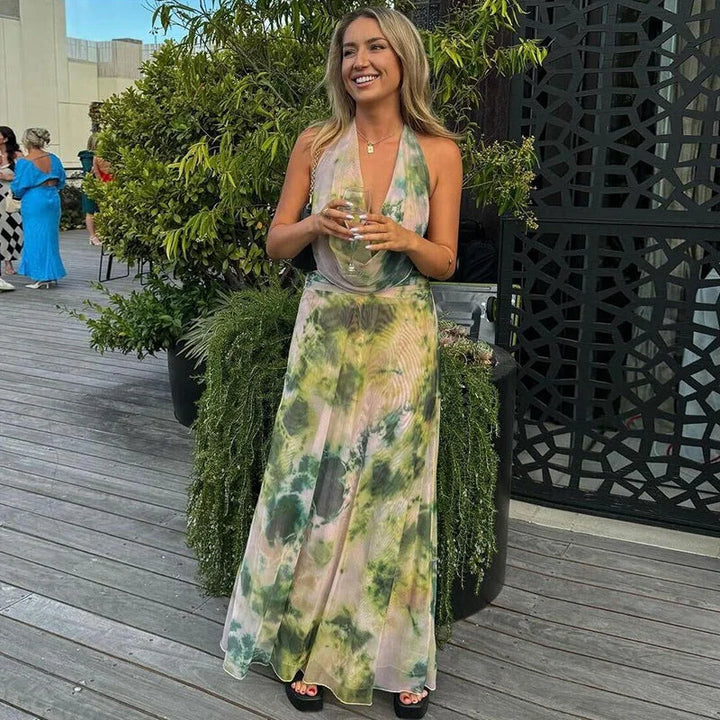 Colorful tie-dye halter dress with a backless design, perfect for a casual summer look.
