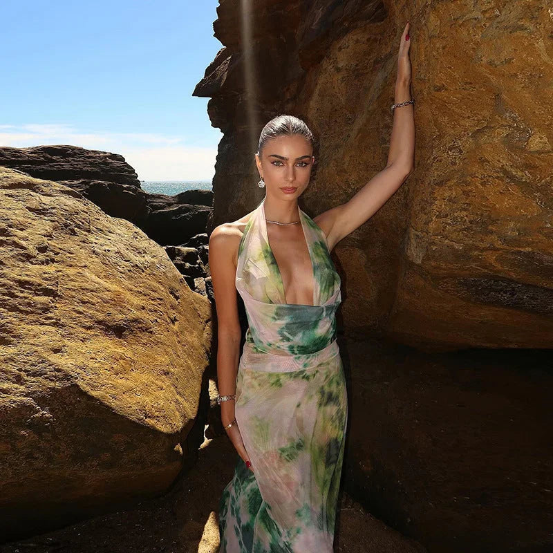 Colorful tie-dye halter dress in a backless design, perfect for a bohemian look.