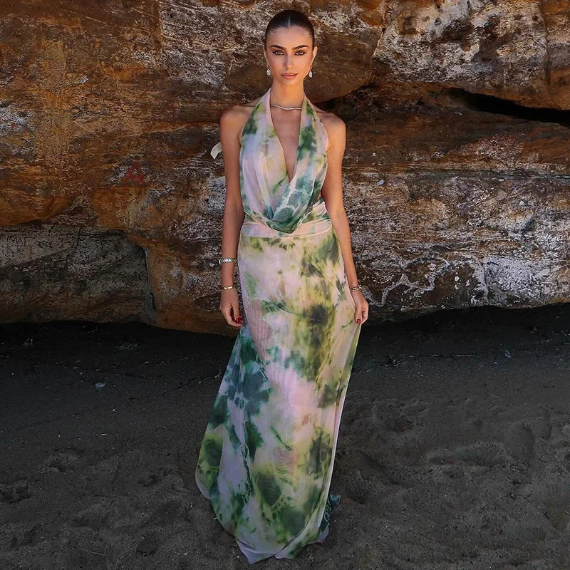 Colorful tie-dye halter dress with backless design. Made of lightweight and airy fabric perfect for summer outings.