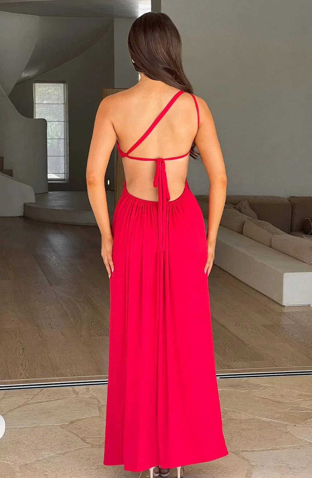 Women's flowing one-shoulder maxi dress in a soft, breathable fabric with a relaxed silhouette, perfect for effortless…