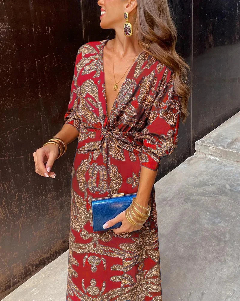 "Navy blue midi wrap dress with bishop sleeves, featuring a floral print and tie waist detail - perfect for effortless yet…