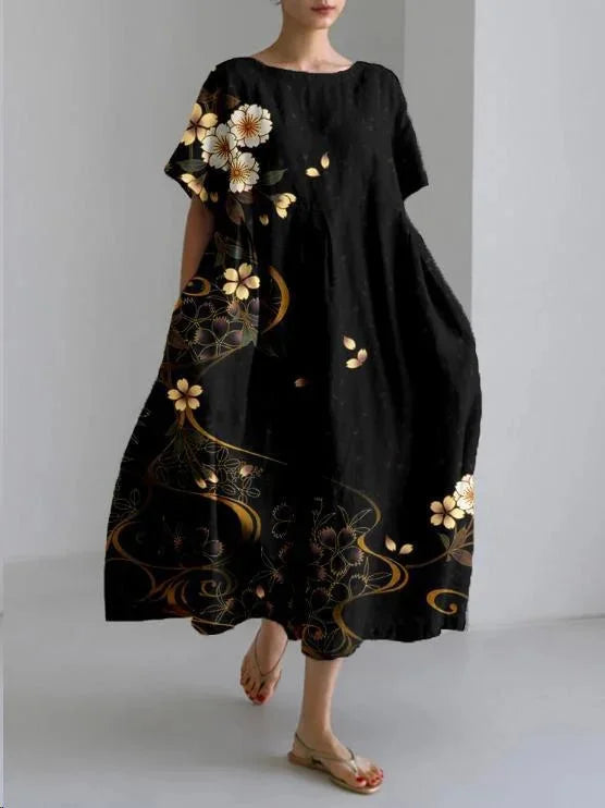 Black maxi dress with gold flower print, designed for comfort. Soft and flowy material perfect for everyday wear or special…