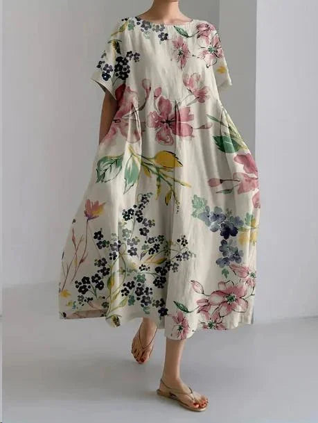 "Floral maxi dress in Summer meadow print, designed for comfort, made from lightweight fabric with adjustable straps."