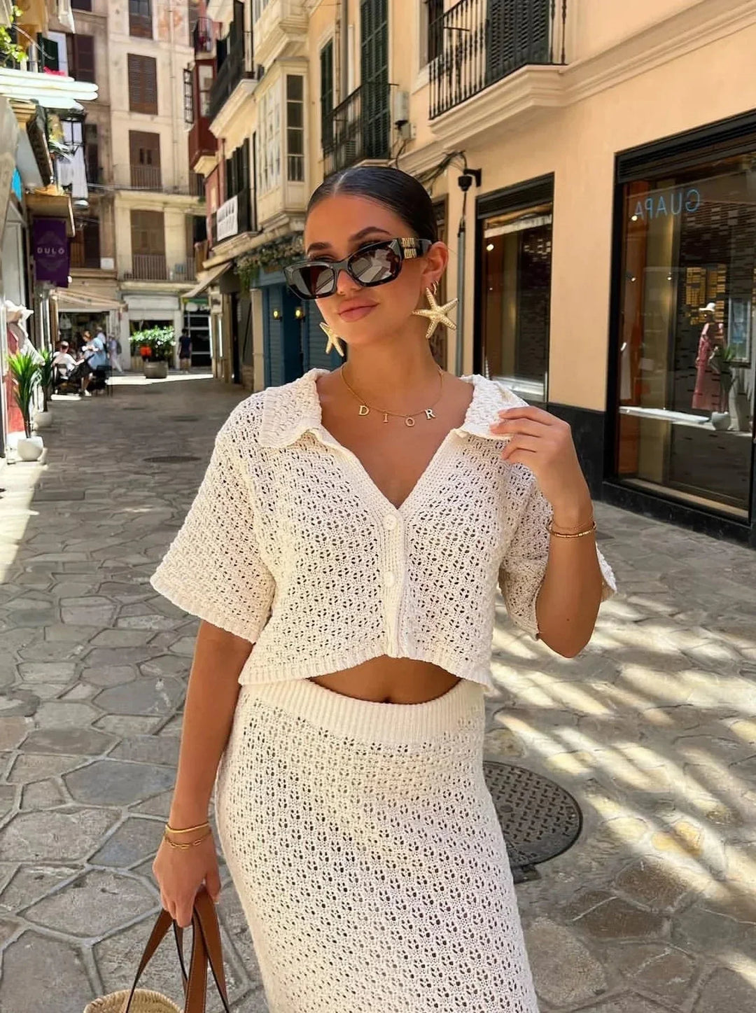 "Beige crochet top and skirt set with intricate design and detailed stitching, ideal for a bohemian-inspired look."