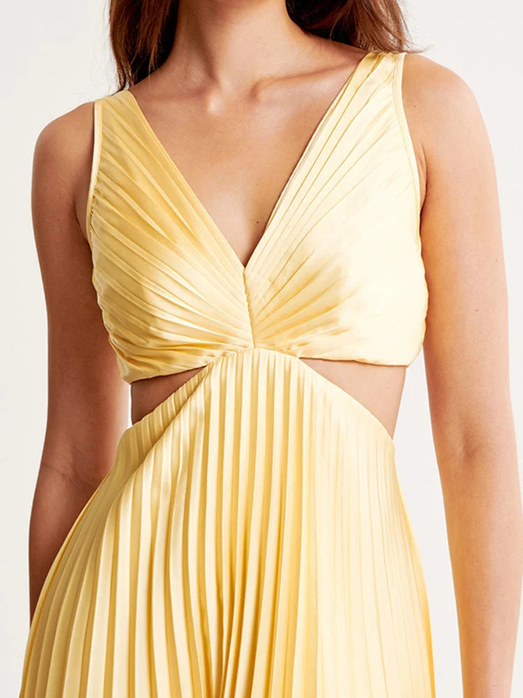 Yellow maxi dress with plunging neckline, pleated design. Made of lightweight fabric, perfect for sunny days.