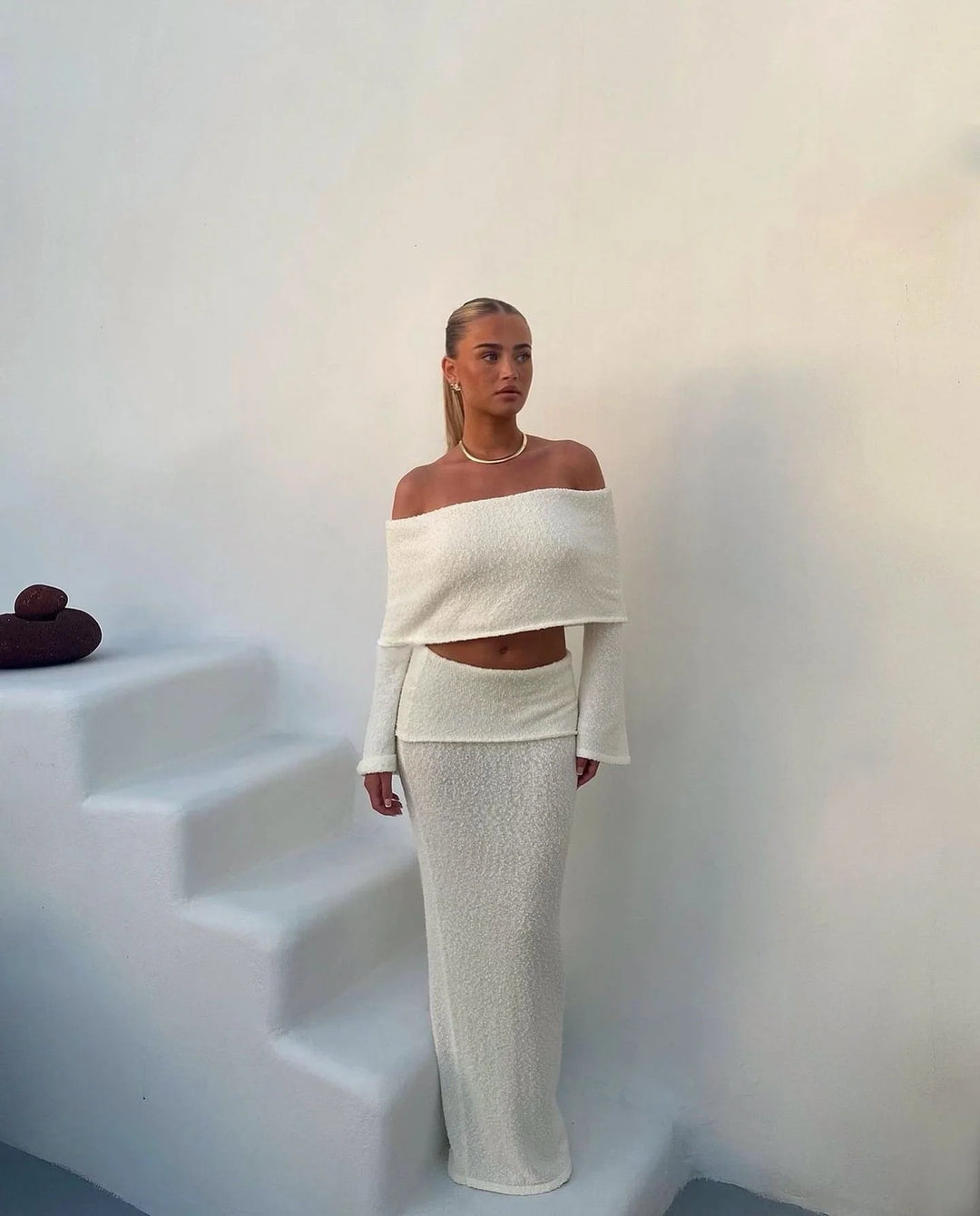 Off-shoulder white two-piece set with glitter detailing, perfect for a stylish and trendy look.