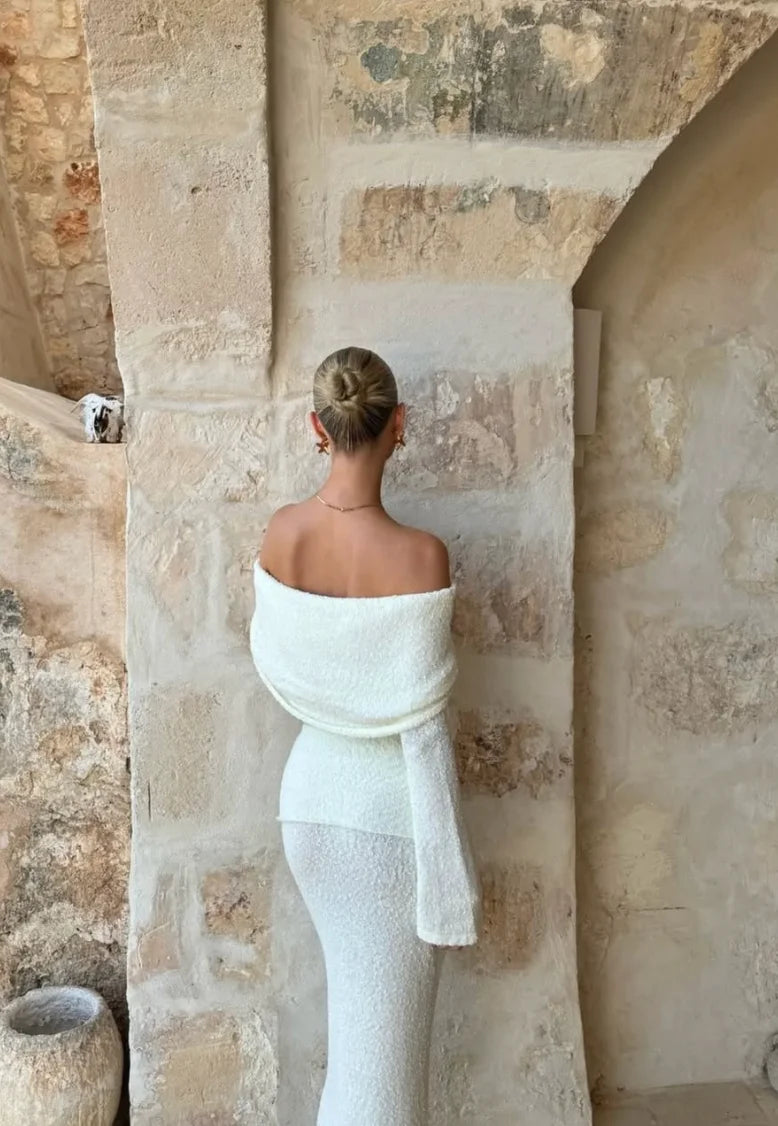 Off-shoulder white glitter two-piece set with a fitted top and skirt, perfect for a stylish and elegant look.