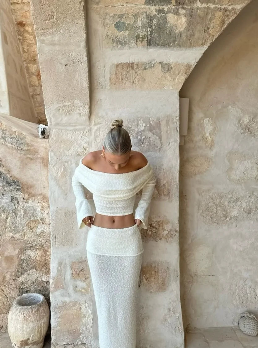 Off-shoulder white two-piece set with shimmering glitter detail, perfect for a fancy evening out.