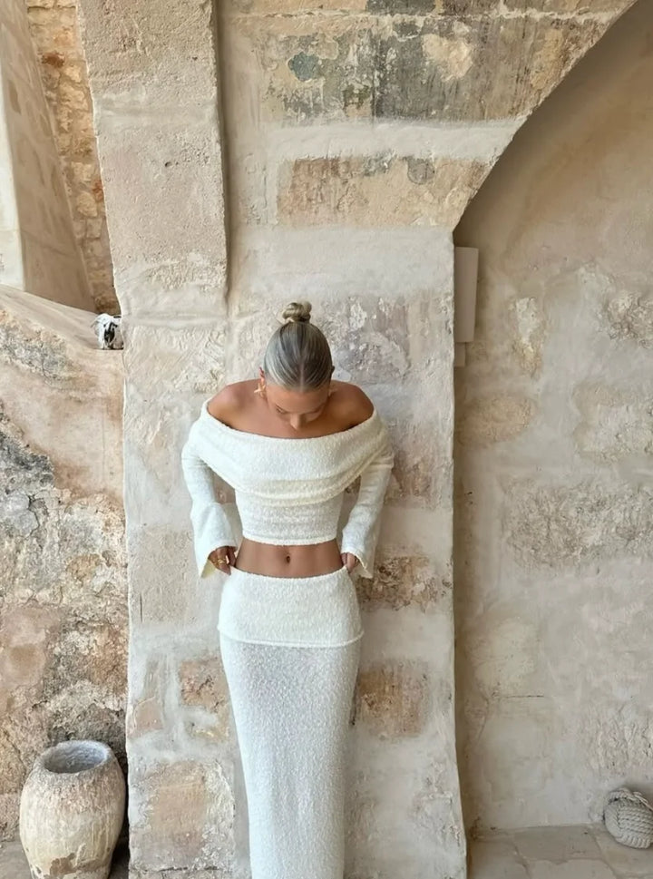 Off-shoulder white two-piece set with shimmering glitter detail, perfect for a fancy evening out.