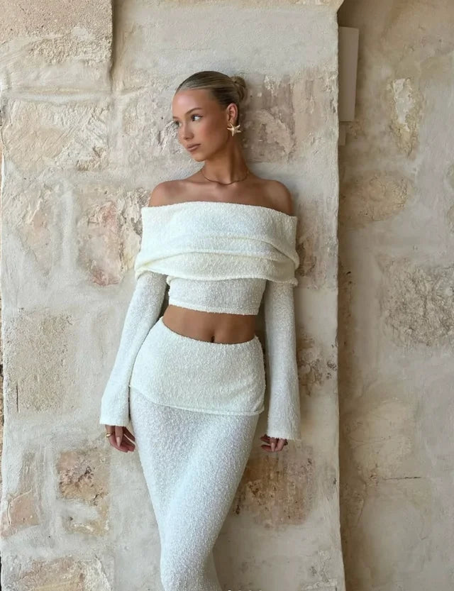 Off-shoulder white glitter two-piece set showcasing a glimmering fabric perfect for special occasions or nights out in the…