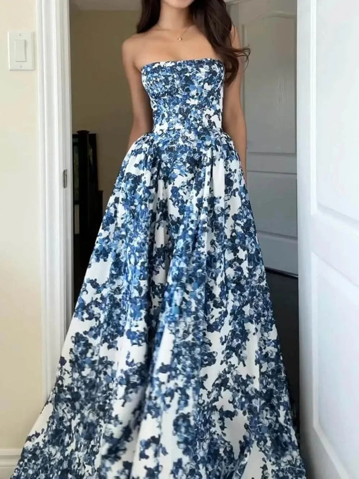 Strapless blue floral printed maxi dress showcasing a vibrant design with a flowy silhouette, ideal for a summery casual or…