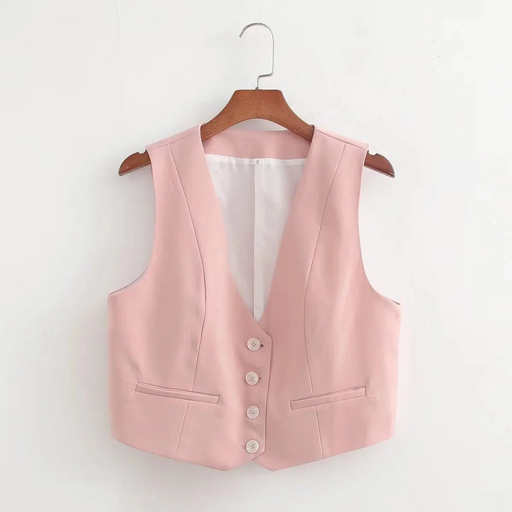 Soft pink V-neck vest made of knit fabric with elegant button details.