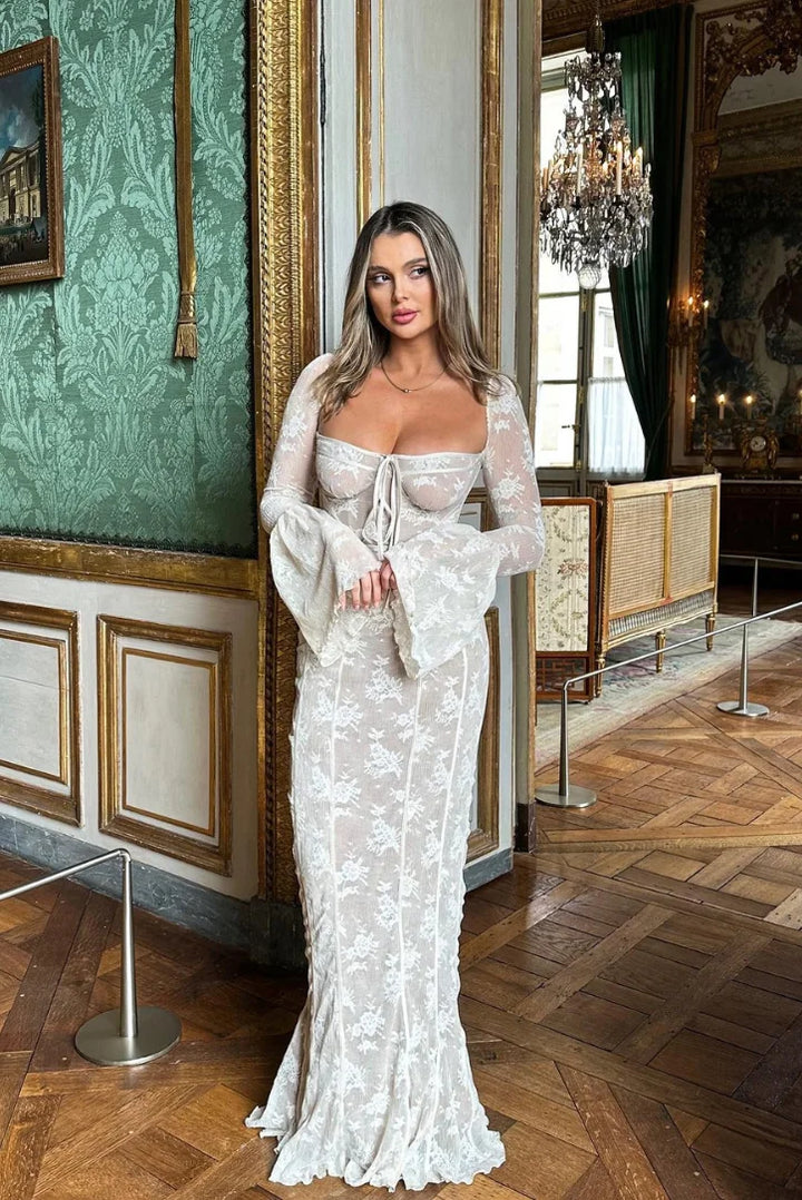 White lace off-shoulder dress for women by Bushra. Clings perfectly to body with feminine lace detail. Ideal for special…