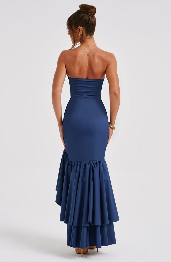Strapless dress with asymmetrical ruffle skirt, crafted in soft cotton blend fabric, perfect for a chic and stylish look.