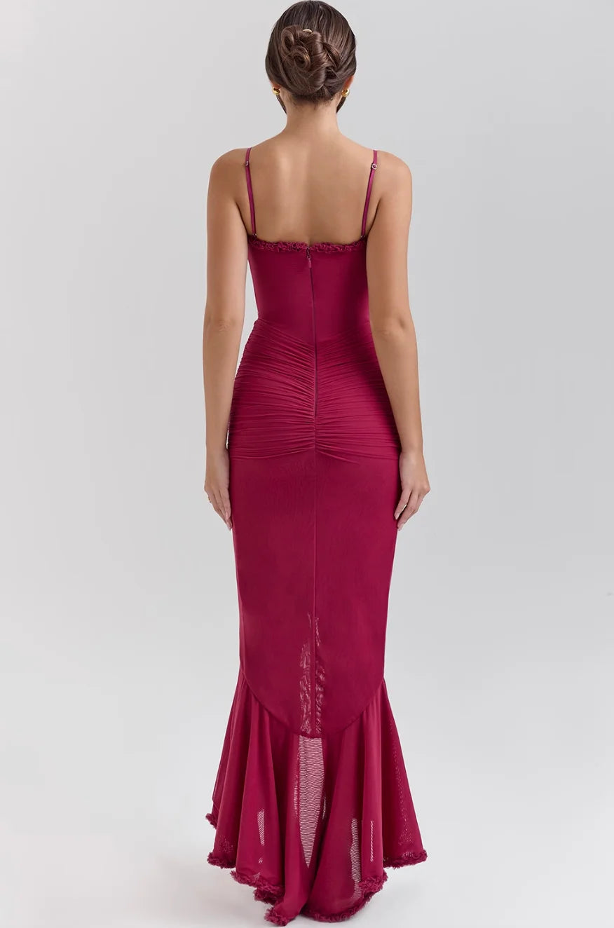 Black fitted midi dress with ruffled details, perfect for a chic look. Made of stretchy material for a comfortable fit.