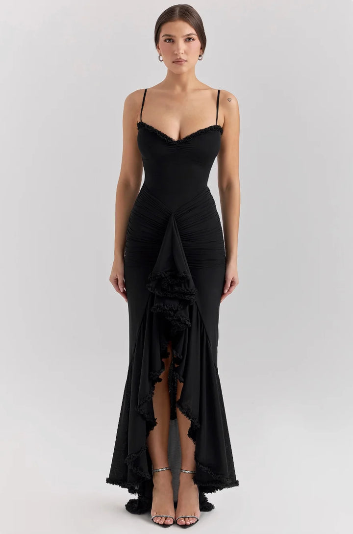 Black midi dress with ruffled details, form-fitting silhouette. Made from comfortable, high-quality fabric. Ideal for a chic…