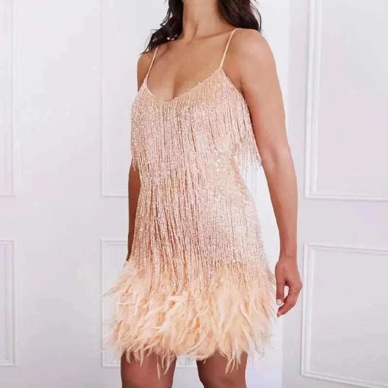 "Calypso spaghetti strap mini dress featuring sequins and feathers, perfect for a glamorous and chic evening look."