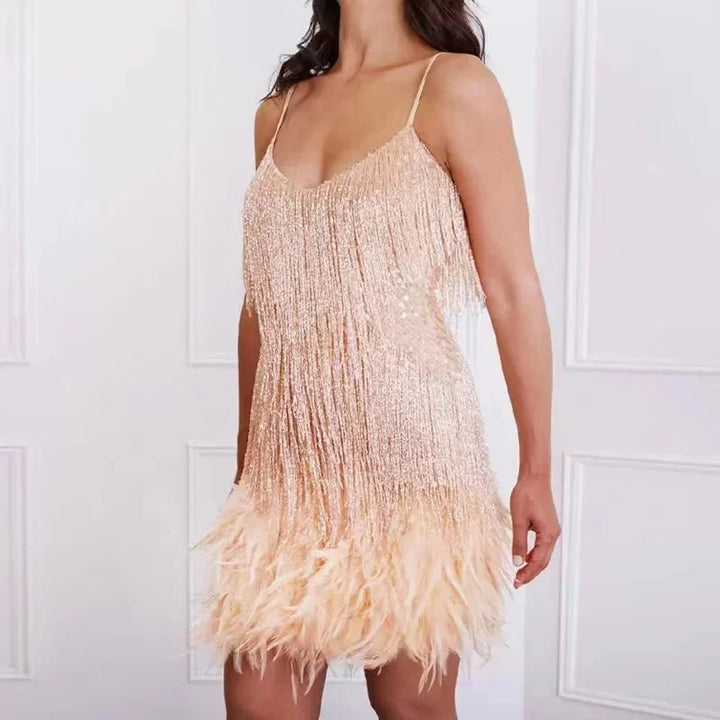 "Calypso spaghetti strap mini dress featuring sequins and feathers, perfect for a glamorous and chic evening look."