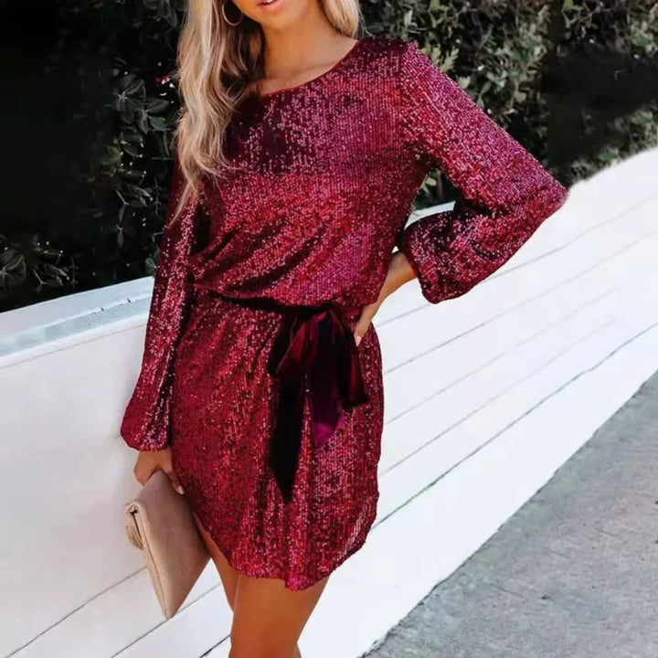 "Red sequin dress with balloon sleeves, perfect for a dazzling night out with friends."