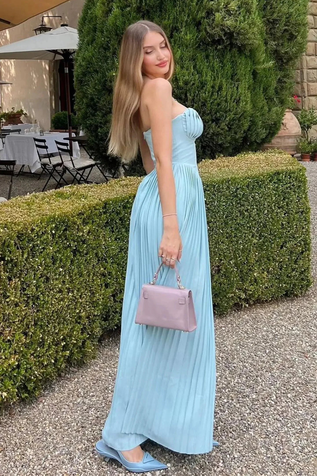 Light blue pleated dress with a sweetheart neckline and a flowy design, perfect for a chic and elegant look.