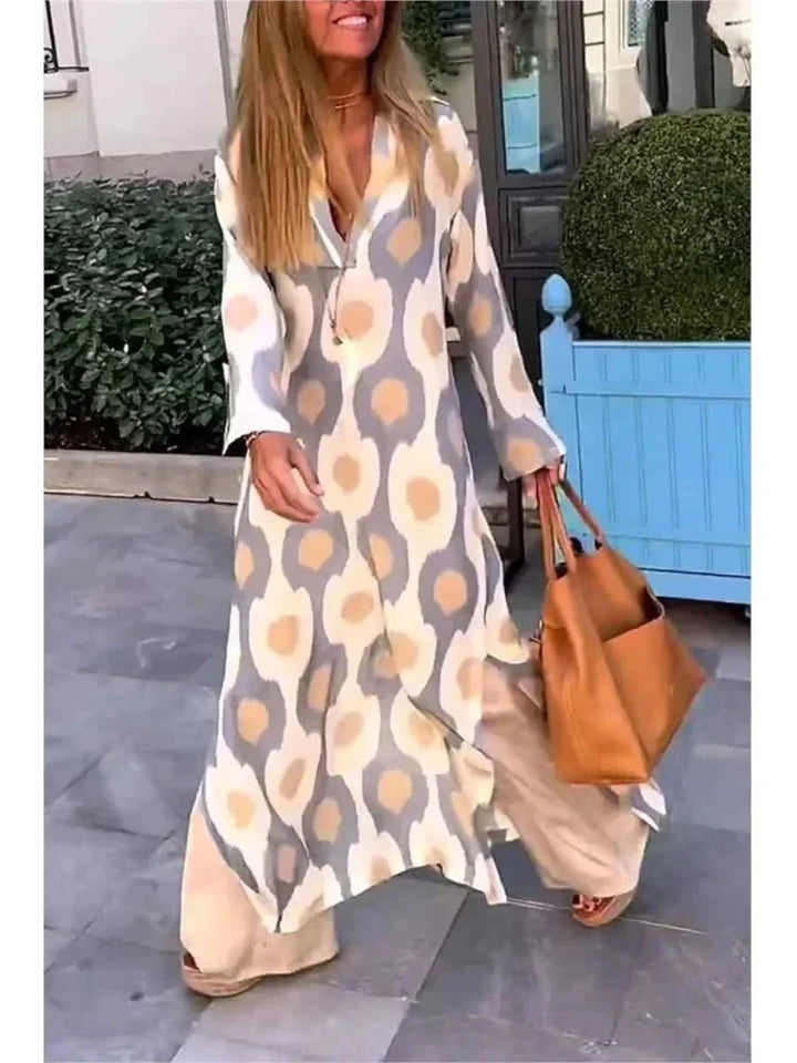 "Camryn long-sleeve V-neck maxi dress in olive green, featuring a flowy silhouette, comfortable fabric, and flattering…
