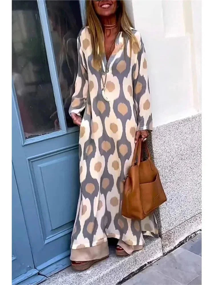 "Camryn long-sleeve maxi dress in black with a flattering V-neck design and flowy fit, perfect for all-day comfort and…