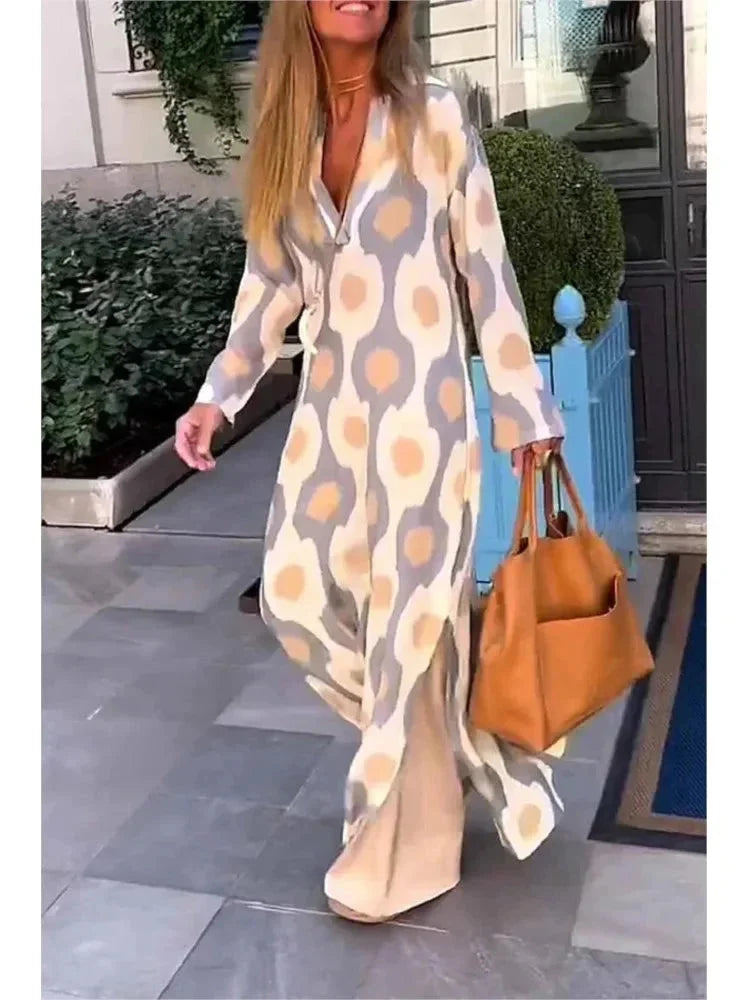 Apricot long-sleeve maxi dress with a flattering V-neck design, perfect for a chic and effortless look.