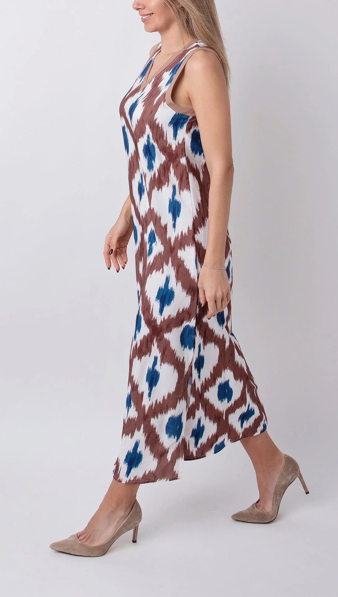 "Sleeveless maxi dress in soft flowy fabric with a flattering V-neck, perfect for any summer occasion."
