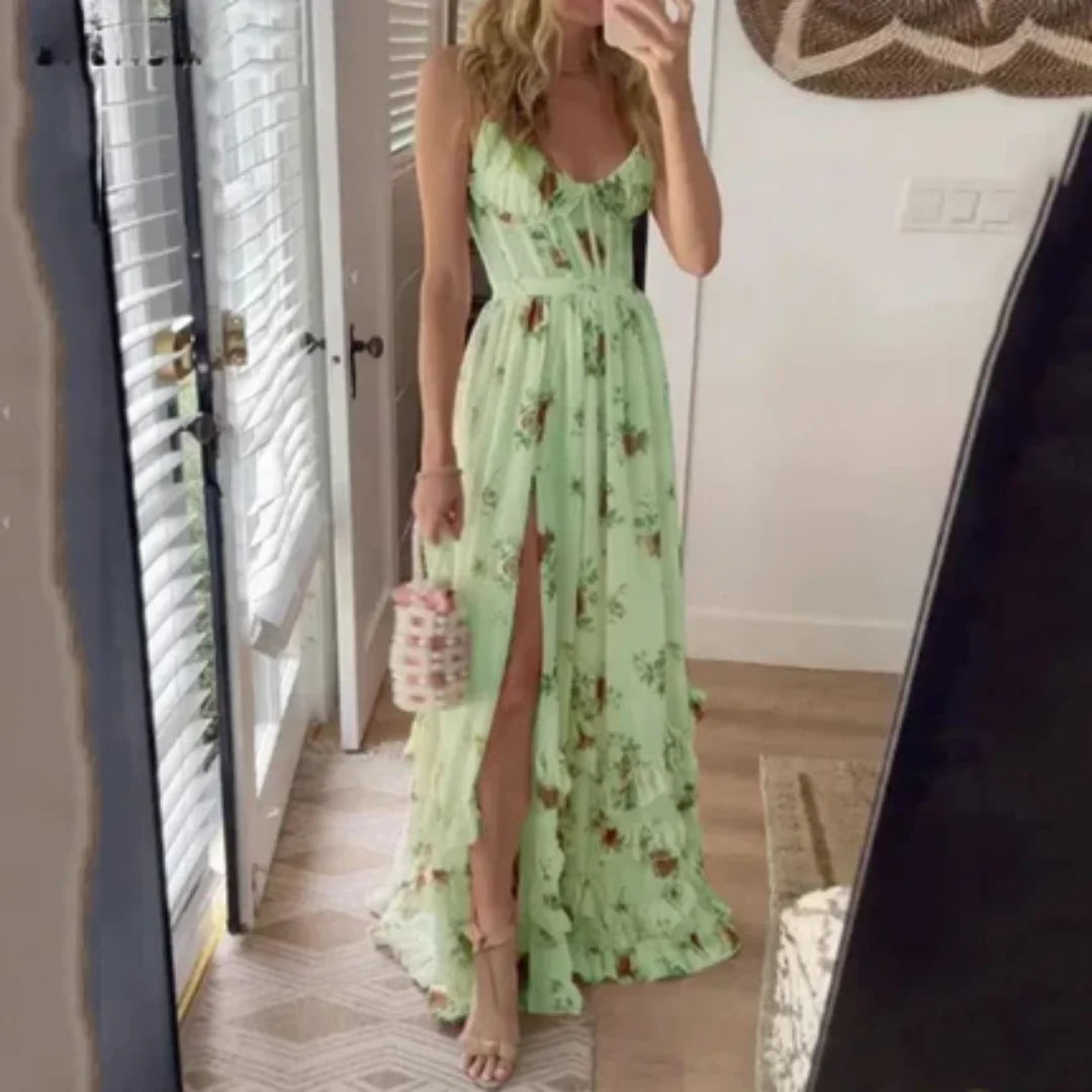 Green sleeveless maxi dress with split front design. Made from lightweight fabric ideal for warm weather. Perfect for…