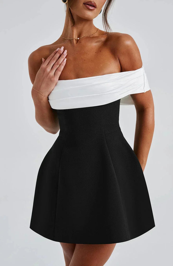 Off-shoulder two-tone mini dress in soft cotton blend with a fitted design, perfect for casual outings or evening events.
